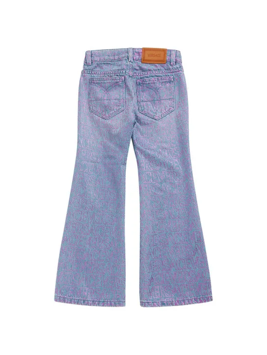 Versace   All over logo print cotton denim jeans 